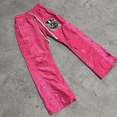 Buy Men's Baggy Fit Nylon Sweatpants with Windproof Design and Distressed Embroidery online manufacture